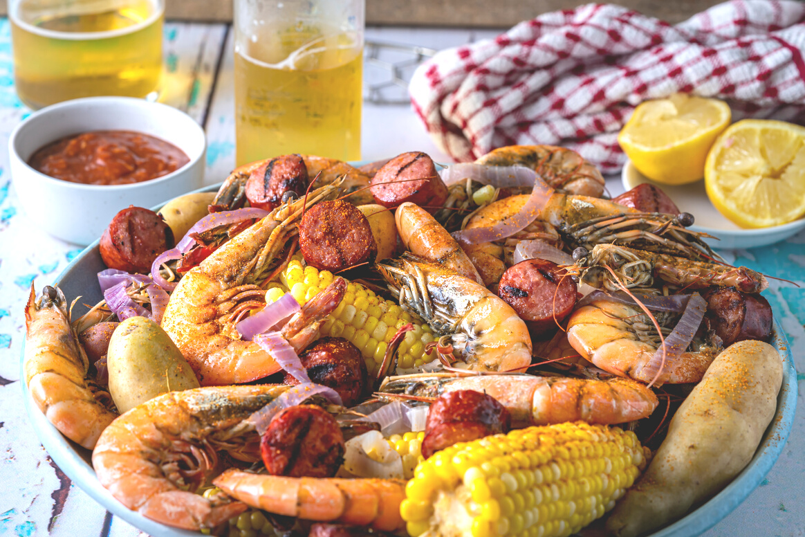 Traditional Southern U.S. Summertime feast. Low Country boil. A stew of shrimp and sausage with spices.